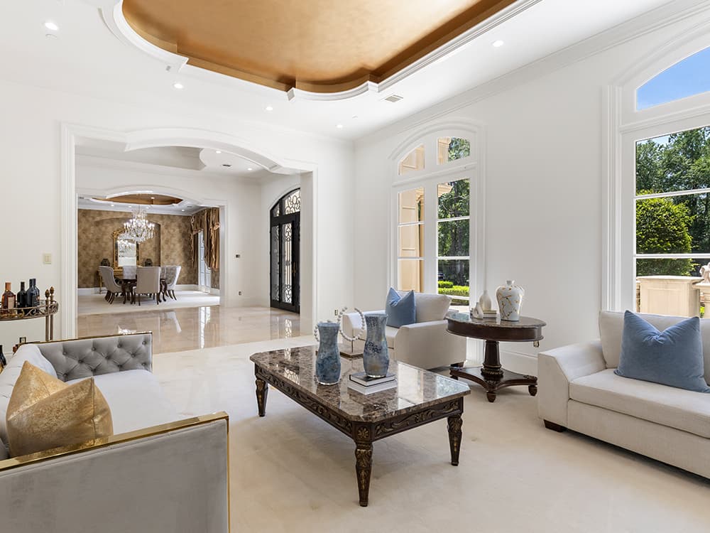 Formal living room with marble floors, arched windows and a gilded ceiling in an estate home on West Grand Regency Circle in Carlton Woods